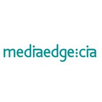 Ubiquitous Taxi Advertising agency MediaEdge  logo